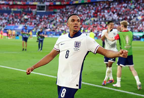 Trent Alexander-Arnold celebrates his winning penalty for England against Switzerland at EURO 2024